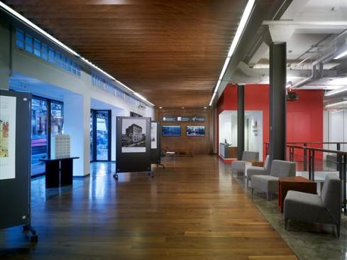 The+wood-clad+lobby+also+serves+an+an+exhibition+venue+to+showcase+projects.+Through+June+30%2c+it+plays+host+to+%22Could+Be%3a+The+AIA%7cDC+Awards+for+Unbuilt+Architecture%2c%22+an+exhibition+curated+by+the+National+Building+Museum.