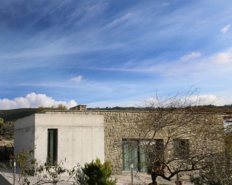 barbaros house with a mountain behind.