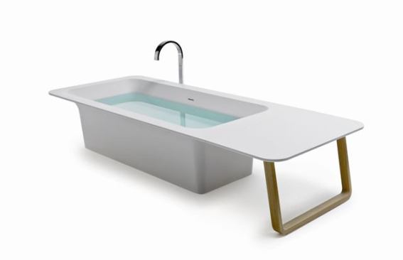 Part of the Origami collection, this bathtub from Stocco is made from a composite material called Cristalplant that is so hygienic that it does not need special cleansing products—just soap and water. Shown in the freestanding versions, the tubs may be personalized using metal panels and various accessories, such as this wood extension. 
www.stocco.it.