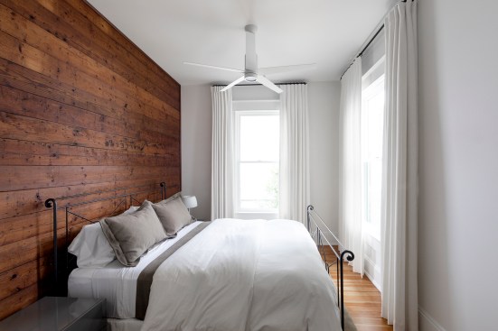 View of guest bedroom with original shiplap wall