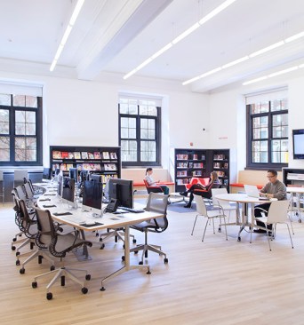 The+first+floor+has+been+redesigned+as+a+commons+where+patrons+can+access+online+materials%2c+through+work+stations+or+wirelessly.+