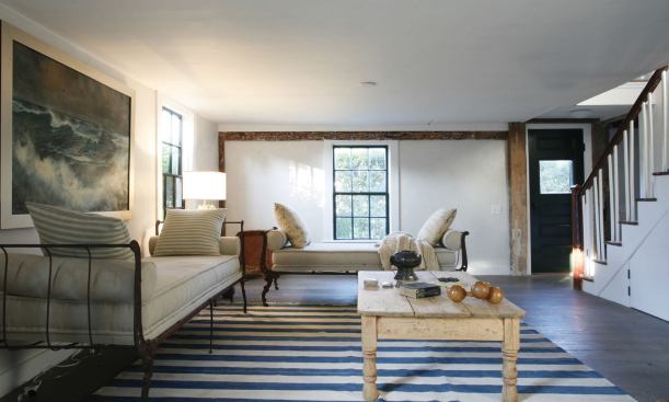 New exterior sheathing, air barriers, and cavities insulated with Icynene spray foam tightened the existing shell; historic single-pane windows were restored and upgraded; and interiors were finished with American Clay natural plaster.