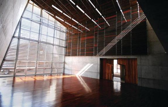 The double-height community hall is used for concerts and other events that encourage neighbors to engage with the center.