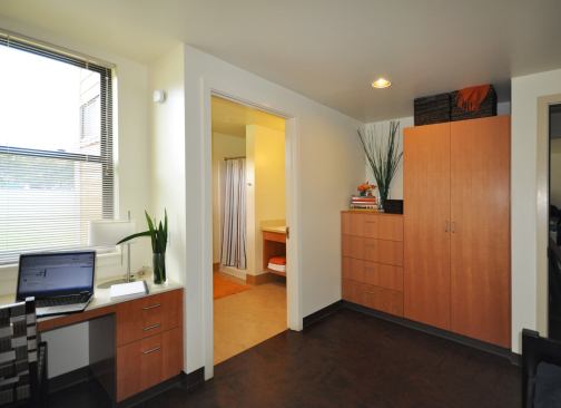 Private bedrooms feature radiant-heat floors, built-in cabinetry, and individual programmable thermostats. All lighting fixtures are connected to occupancy sensors.