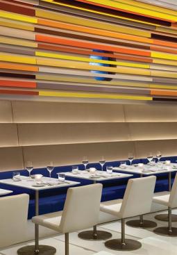 Cascading walls lead down to comfortable banquettes.