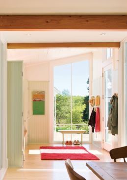 The new back hall addition channels daylight and backyard views to the adjacent kitchen and dining area.