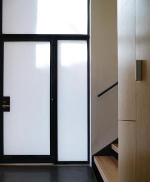 The entry door from the stairway entry hall. 