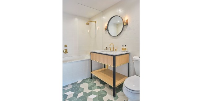 New 2nd bathroom with custom steel frame vanity with stone top and rift white oak panels. 