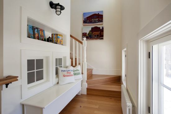 Open and laden with windows, the three-story stairwell brings in light, captures cool northern breezes, and exhausts heat. The windows on the left funnel light into a small interior bathroom.
