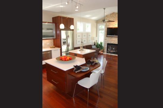 In the kitchen, a staggered-height island was designed to incorporate an extra-high countertop after research at the IDeA Center found that leaning over while using a knife was one of the leading causes of kitchen injuries.
