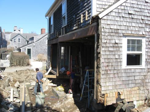 Upgrades to this historic renovation included sealing and insulating the existing crawl space into a conditioned crawlspace, re-sheathing and air-sealing the exterior walls and roof, installing spray-foam insulation into wall cavities, restoring the historic window sashes and improving their energy efficiency, and re-siding the home with new cedar shingles.