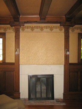 The fireplace, prior to restoration. The plaster relief was covered by drywall and the wood mantle had been refaced with marble.