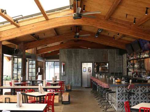 The Crack Shack restaurant in Encinitas, CA uses their MacroAir fans to help circulate the nearby cool coastal air within the restaurant via their open air concept design.
