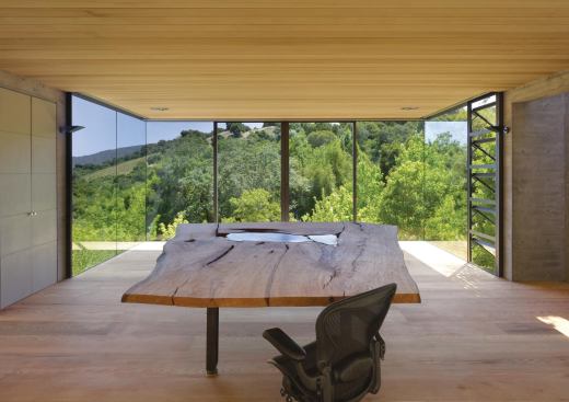 Operable awning windows and surrounding deciduous trees help cool the project during the summer months.
