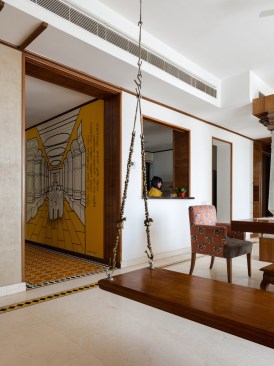Attukattil Jhula (swing), crafted in wood with traditional oonjal supports done in brass