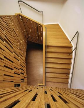 CNC-fabricated bamboo paneling in staircase