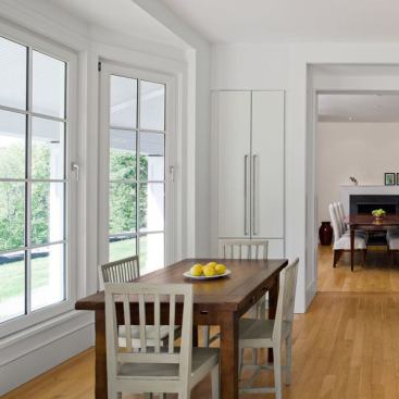 Architect: John Tittmann, Albert, Righter & Tittmann, Boston, MA &nbsp; Marvin clad Magnum Tilt/Turns, Ultimate Double Hungs, and Ultimate Inswing French Doors with simulated divided lites provided the scale and proportion the design demanded, and contributed to Energy Star qualification and 15% less energy consumption than that prescribed by code.