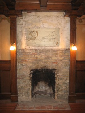 Stripping the drywall and marble revealed the plaster frieze and original brickwork.