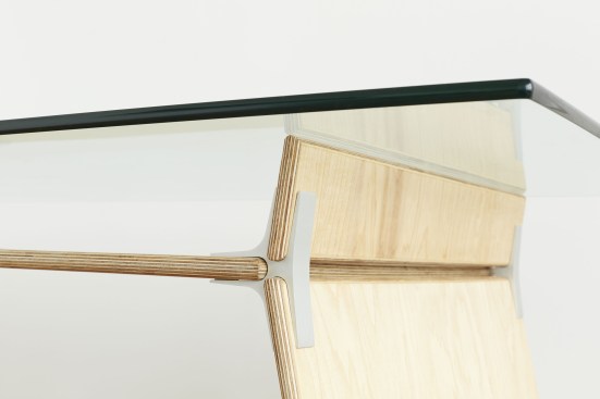 A detail of a wood-and-glass desk designed by New Lab member EcoSystems Brand from its new line, Modos.