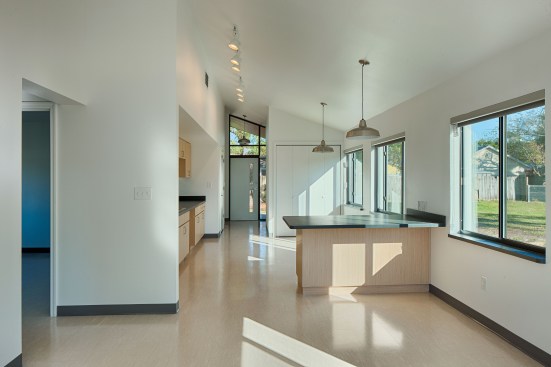 Ample windows bring daylight into the compact space.