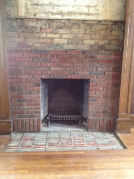Masonry subcontractor Dan McMillan repaired the brickwork by removing the old bricks, turning them around, and then reinserting them with the undamaged face showing.