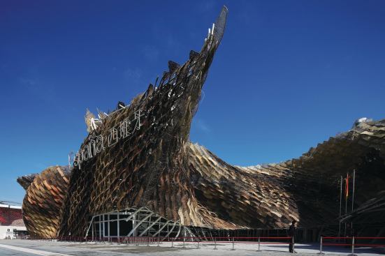 Spanish pavilion - EMBT Dubbed "The Basket" by visitors, its skeletal steel structure is wrapped with more than 8,000 unique wicker panels handmade by Chinese craftsmen. The lobby is dominated by Miguel’n, a 21-foot-tall animatronic baby.