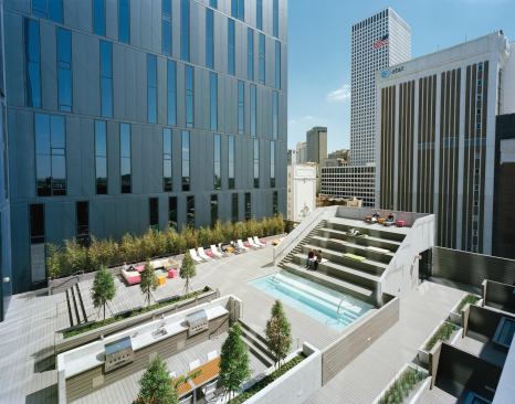 The sky lobby is not the only lounge space in the complex: The ninth-floor deck features a pool, terraced seating and chaises for sunbathing, and a grilling area for resident use.