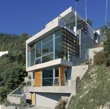 Outside, stationary fir louvers help moderate the suns impact on the house.