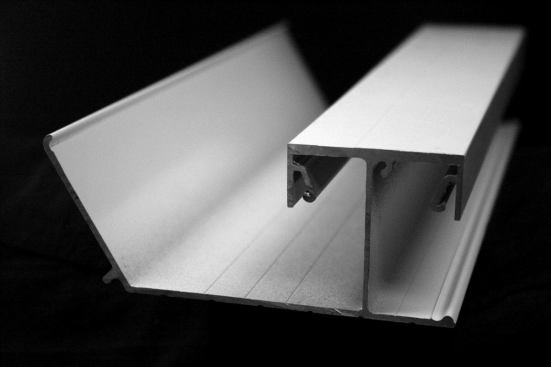 Dry Joist EZ has only two SKUs: an 8" main board and the 4" multi board pictured here, which is an all-in-one start board, finish board, and railing mount. Flashing receivers and cut lines are extruded into the multi board.