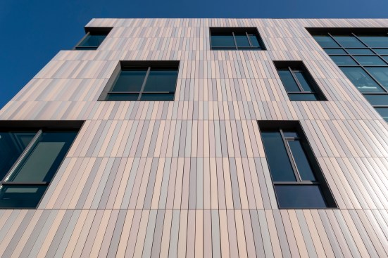 This is the first campus building to include terra cotta in 80 years, melding innovative performative façade cladding technology with a geometric color field of 5 custom glazes based on regional landscape tones. UO Tykeson Hall, OFFICE 52 Architecture, Design Architect.