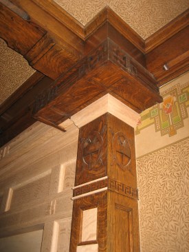 Drawing on details from elsewhere in the room, cabinetmaker Jon Frost created a new white oak over-mantle. Intricate molding surrounds the fireplace that was faithfully restored using original details as a guide.