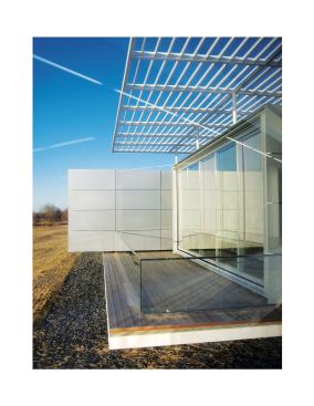 The building's west facade is interrupted by a series of projecting bays that house private offices, training rooms, and conference spaces. An ipe deck runs in front, providing outdoor space for employees. Glass guardrails prevent someone from stepping off the edge but don't interrupt sight lines.