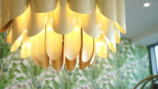 This custom pendant was built for the communal space to reflect vintage Miami design. 