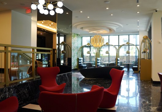 This custom pendant was built for the communal space to reflect vintage Miami design. 