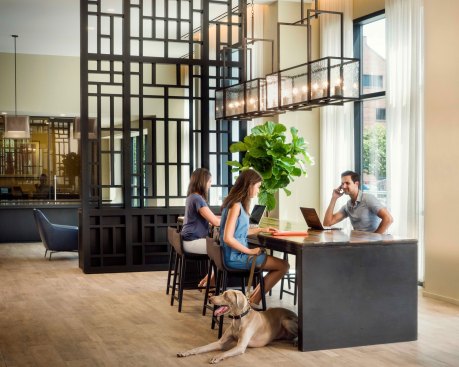Merina Meriel Bay’s lobby features a communal “tech table” constructed of recycled wooden posts from the Venice Lagoon. The ocean-inspired piece provides a place to sit and recharge both mind and device.