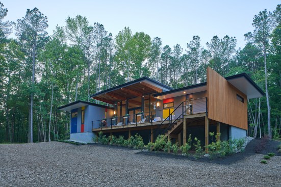 The house is raised where necessary to accommodate the nature contours of the land.