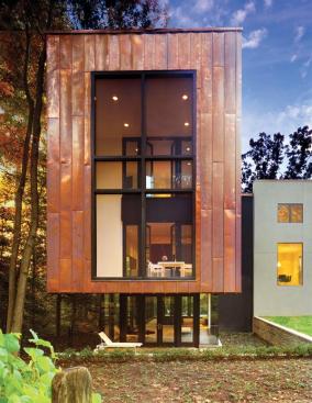 Jameson modernized the Georgian Colonial split-level and added a rear volume whose 18-gauge copper cladding and single-lock seams give it a lightweight quality.