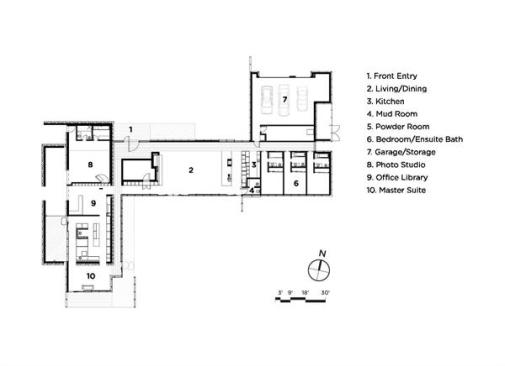 The linear plan houses the living areas in the middle and bedrooms on the east. A perpendicular bar contains a photo studio, library, and master suite.