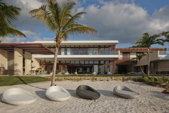 The home’s backyard offers access to the beach.