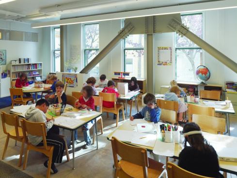 Seismic bracing was added to bring the building up to code. But instead of hiding the bracing, the architects left it exposed in common spaces, hallways, and even classrooms. The goal was to be transparent about the renovations made to the building, so the design can be a learning tool to educate the students about design and engineering.