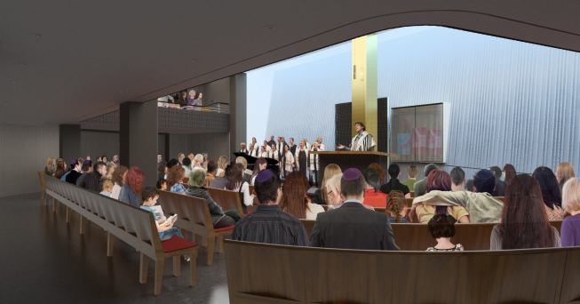 The sloping wall at the far end of the main sanctuary is washed in daylgiht that filters trhough skylights above.