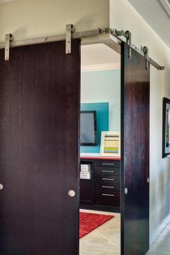 As part of a floor plan catering to young families, this home office is situated adjacent to the kitchen and dining area, allowing its occupants to stay connected to kids arriving home from school, while a set of sliding doors offer peace and quiet when it’s time to get to work. Project: Gen Y House, Orlando, Fla.; Architect: Woodley Architectural Group, Denver; Builder: Centerline Homes, Coral Springs, Fla.