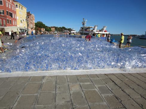 A student installation on the Grand Canal formed a vaulted meeting space out fo 30-foot-long plastic bags filled with recycled bottles.