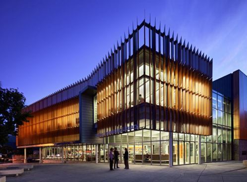 A view of the building entrance at night.