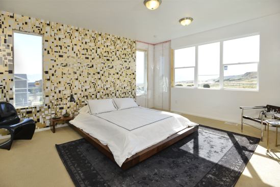 Daylight fills the master bedroom, thanks to plentiful argon-filled low-E windows.