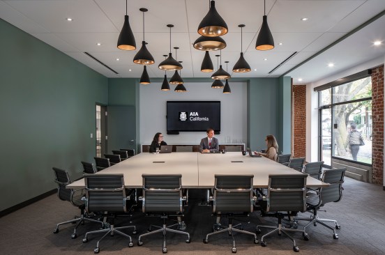 A large conference room is at the center of the building and can be closed off for privacy when needed, by two large doors separating the front entry spaces and the back open offices. 