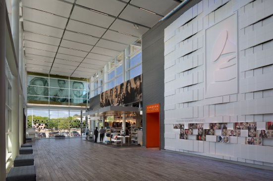 The all-glass lobby acts as a "screened porch" where visitors can enjoy the views of the site comfortably from indoors