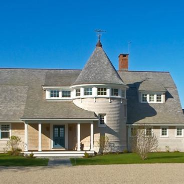 Architect: Jacob Albert, Albert, Righter & Tittmann, Boston, MA &nbsp; Local Shingle Style traditions informed this New York seaside vacation retreat. Lighthearted and picturesque, elements like the round tower, gently flared gambrel roof, and strong, continuous eave line combine to provide rhythm, interest and timeless beauty.