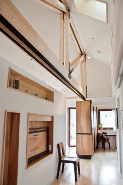 The exposed framing can also be seen in the hallway.