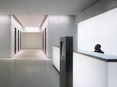 The reception desk area and elevator lobby beyond.